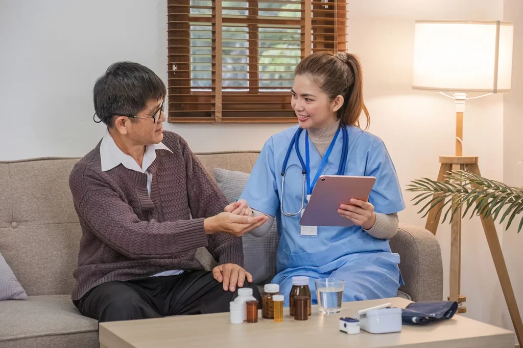 woman healthcare professional visiting senior man